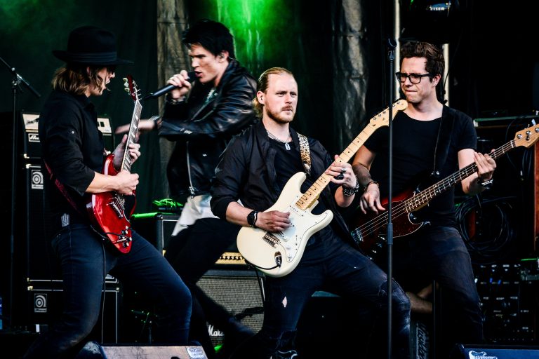 A rock band performing on stage